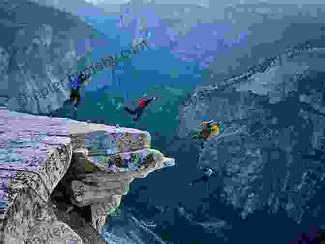 A Group Of Base Jumpers Leaping Off A Cliff With Stunning Mountain Scenery In The Background Extreme Base Jumping (Nailed It )