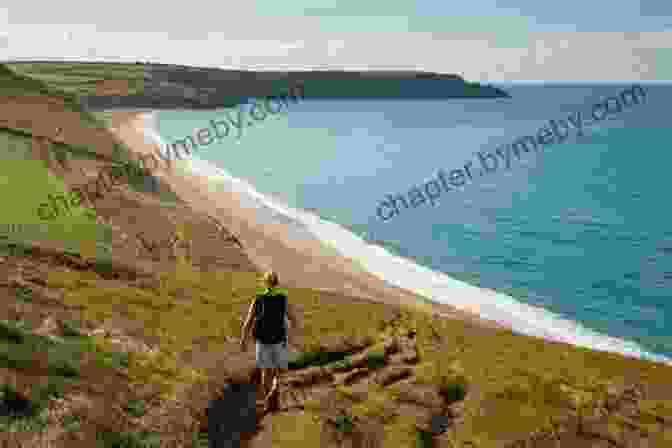 A Hiker Admiring The Breathtaking Coastal Views Along The South West Coast Path Walking The South West Coast Path: National Trail From Minehead To South Haven Point (UK Long Distance Trails)