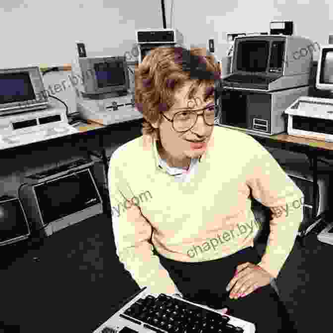 A Young Bill Gates Sitting At A Computer, Smiling Bill Gates: A Biography (Greenwood Biographies)